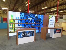 Custom Inline Exhibit with SuperNova Backlit Lightboxes, (4) Product Shelves, Storage Closet, Fabric and Direct Print Graphics, Reception Counter w/ Open Storage, and Counter w/ Locking Storage and Wireless Charging Pads